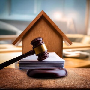 A house with a judge gavel depiction of he legal process